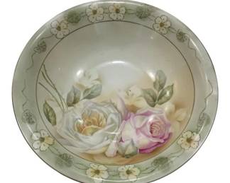 958 - Germany Porcelain Serving Bowl w/ Floral (Description): Featuring a hand-painted rose design in pink,  white, and yellow tones at the center,  surrounded by a delicate border of white  flowers and green foliage in an Art Nouveau  style. The bowl measures 10 inches in diameter by 3 inches deep.