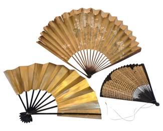 1449 - 3 Oriental Folding Fans, Longest 13" Closed (Description): The fans feature gold-toned paper leaves with  wooden sticks. The largest fan displays a  floral design on a gold background with brown  wooden sticks. A second fan features solid  gold-leaf paper with black lacquered sticks and decorative carved ends.The smallest fan  has a woven or textured gold paper leaf  mounted on black lacquered sticks with a  tassel cord.