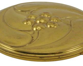 1752 - Vintage Volupte Compact 4" (Description): Vintage Volupte compact measuring 4 inches in  diameter. This classic goldtone compact  features an embossed lid design and hinged  closure.