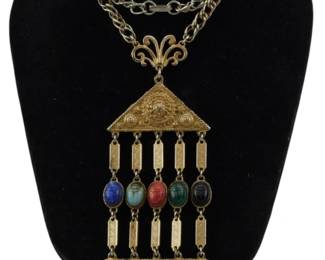 1936 - Hattie Carnegie Egyptian Revival Necklace (Description): Vintage Egyptian Revival Hattie Carnegie  Etruscan style necklace. This statement piece  features the ornate goldtone metalwork and  Egyptian-inspired design elements  characteristic of Hattie Carnegie's distinctive costume jewelry.