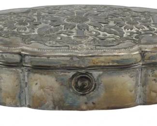 878 - Made in Occupied Japan Silver Plate Box (Description): A silver plate box marked as made in Occupied  Japan. The box features a decorative lid  with embossed floral designs and stands on  small feet. Measures 2 inches high by 6  inches wide by 3.5 inches deep.