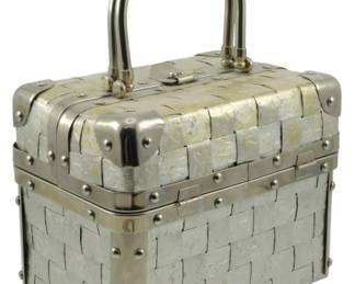 1776 - Delill Trunk Handbag Silver Foil 6"x8"x5" (Description): Delill trunk handbag in silver foil. This  structured box-style purse features the  distinctive woven metallic design Delill is  known for. Measures 6 inches wide by 8 inches  long by 5 inches deep.