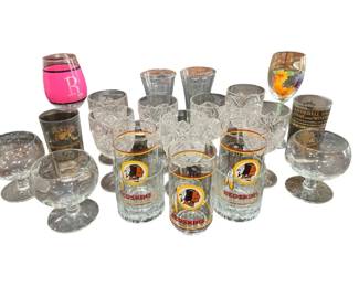 1253 - Assorted Glassware Lot w/ Redskins Glasses (Description): Collection of assorted glassware including  Washington Redskins drinking glasses and beer  mug, crystal punch cups, footed brandy  snifters, souvenir glasses including a  Baseball Hall of Fame glass, a hand-painted rooster wine glass, a pink wine glass with  monogram 'R', and silver-rimmed tumblers. A  diverse lot suitable for entertaining or  collecting.