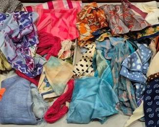 2847 - Lot of Assorted Colorful Scarves (Description): A large collection of assorted scarves in a  variety of colors, patterns, and materials.  The lot includes silk, chiffon, and  lightweight fabric scarves featuring paisley  prints, polka dots, florals, geometric designs, and solid colors. Colors range from  vibrant pinks, oranges, and blues to muted  greens, earth tones, and classic navy.  Various sizes and styles are represented,  suitable for accessorizing or crafting