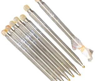 342 - 7 Oil Burning Taper Glass Candles 12.5" (Description): Set of seven glass candles, each measuring  12.5 inches in length. The candles feature  tapered points and decorative tops.