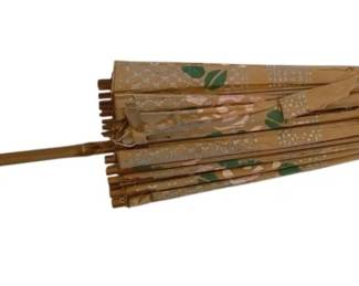 1321 - Large Oriental Paper Parasol 29" (Description): Large Oriental paper parasol featuring a  hand-painted floral design with pink roses  and green leaves against a tan background.  The umbrella has a bamboo handle and wooden  ribs. Measures 29 inches in length.
