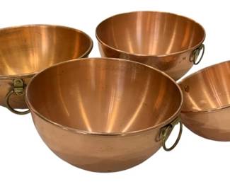 667 - Copper Mixing Bowl Set (4) 5"x9" (Description): A set of four copper mixing bowls with brass  ring handles for hanging. Measures 5 inches  by 9 inches.