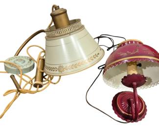 4195 - 2 Vintage Metal Lamps (Description): Two vintage metal lamps. One features a  cream-colored shade with decorative gold leaf  motif, while the other is finished in a deep  red with ornamental detailing. Both lamps  retain their original wiring. Used as is electric/electronic/mechanical  item. No guarantee all components, untested.