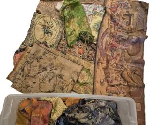 4057 - Tote of Vtg Tapestries, Fabrics & Linens (Description): A collection of vintage tapestries, fabrics,  and linens contained in a plastic storage  tote. The assortment includes several  decorative tapestry panels featuring  classical European figural and pastoral scenes in muted earth tones, a green floral  fabric piece, and various textile remnants in  blues, golds, and patterned designs. The  tapestries display romantic courtly scenes  typical of traditional European decorative