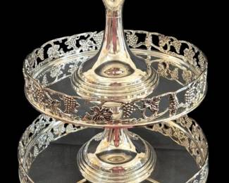 503 - Godinger 3pc Tiered Stand 7.5"x13" (Description): Three-piece tiered cake stand by Godinger  featuring a silver-plated finish with elegant  pierced grape and vine motif borders on each  tier. The stand has a classic pedestal  design with three graduated circular tiers.