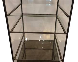 2754 - Vintage Glass & Metal Store Display Showcase (Description): Vintage store showcase featuring a metal  frame construction with glass panels on three  sides. The display case has two interior  glass shelves creating three tiers for  merchandise presentation. The wooden top shows aged patina consistent with  antiquestore fixtures. Open back design  allows for easy access to displayed items.  Measures 20" x 14" x 14".