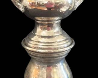 521 - Silver Plate Champagne Bucket on Stand 20"x9. (Description): Trophy champagne bucket on matching pedestal  stand with engraving. The urn-form bucket  features a flared rim with decorative beaded  edge and twin scrolled handles. The  baluster-form pedestal base displays elegant ringed banding detail.