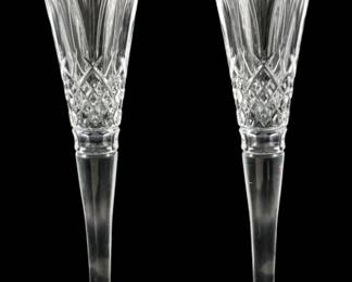 136 - Pr Waterford 100 Years Times Square Stems 11" (Description): A pair of Waterford 100 Years Times Square  crystal champagne flutes with original box.  Each stem measures 11 inches in height.
