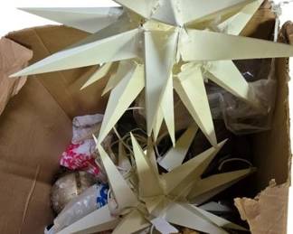 4093 - Box Lot of Moravian Star Ornaments (Description): Box lot containing Moravian star ornaments  and decorations. The lot includes several  multi-pointed star decorations in white and  cream colors, along with gold-toned  ornamental balls. Some stars appear to be designed for hanging or display purposes.
