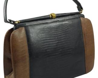 1796 - Vtg Palizzio Genuine Lizard Skin Handbag (Description): Vintage Palizzio genuine lizard skin handbag  featuring two-tone coloring with a frame  closure and single top handle. Measures 8  inches wide by 11 inches tall by 3 inches  deep.