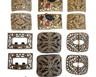 1481 - Vintage Decorative Shoe Buckle Group (Description): A striking collection of assorted vintage  belt buckles and decorative accessories,  featuring a variety of ornate styles and  finishes. This lot includes 14 pieces with  intricate metalwork, rhinestone embellishments, and several jeweled examples  with colored stones. Typical wear consistent  with age and use. Some may show minor  tarnish, surface wear, or missing  stones—please review photos carefully for