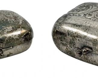 742 - 2 Vintage Metal Compacts (Description): Two vintage metal compacts. Both feature  hinged closures and rounded rectangular forms  suitable for carrying cosmetics or small  items.