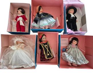 1395 - Lot of 6 Madame Alexander Dolls (Description): A lot of six Madame Alexander dolls, each  presented in original boxes. The collection  includes dolls in various outfits and  costumes.