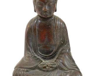 328 - Seated Buddha Statue 7" (Description): Seated Buddha statue depicting the figure in  traditional meditation pose with hands  resting in lap. The Buddha is shown in  flowing robes with characteristic curled hair  and serene expression. The piece displays a rich patina with warm brown and dark green  tones. Measures 7 inches.