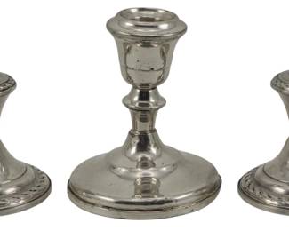 706 - 3 Sterling Weighted Candlestands (Description): Three sterling silver weighted candlestands.  The largest measures 5 inches in height.