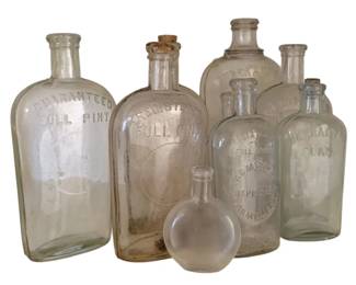 1659 - 9 Clear Assorted Bottles - 9.5" Tall