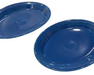 934 - 2 Blue Fiesta Oval Serving Trays (Description): The trays display a rich cobalt blue glaze  and are designed for serving or display  purposes. Measures 9.5 x 13.5
