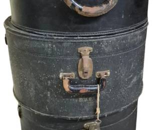 4089 - 3 Vtg Black Hat Boxes Full of Fabric Linens (Description): Three vintage black hat boxes filled with  fabric, linens, and other assorted items. The  hat boxes feature leather handles with metal  hardware and clasps, showing attractive  patina and wear consistent with age. One box displays monogrammed initials. The stackable  round boxes vary slightly in size and style,  representing classic early to mid-20th  century luggage design.