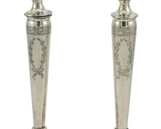 723 - Pair N.S. Co. Weighted Sterling Candlesticks (Description): Vintage N.S. Co. weighted sterling silver  pair of candlesticks. The candlesticks  feature elegant tapered stems with engraved  wreath and bow decorations. Measuring 8.5  inches in height.