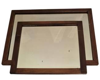3957 - Pr Howerton Beveled Wall Mirrors (Description): A pair of wall mirrors by Howerton featuring  beveled glass. Each mirror is set within a  dark wood frame with clean, simple lines. The  rectangular mirrors would complement  traditional or transitional decor settings.