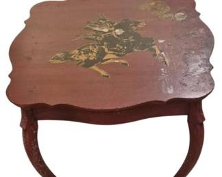 3945 - Oriental Painted Table 15"x24"x24" (Description): Oriental painted table featuring a red  lacquered finish with a gilt figural scene  depicting a warrior on horseback on the  shaped top. The table has curved cabriole  legs and a scalloped apron. Shows significant wear and damage including paint loss and  surface deterioration.