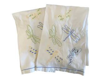 1355 - Pr Embroidered Dragonfly Tea Towels (Description): In soft pastel colors including yellow,  green, and blue. Each towel displays multiple  dragonflies in various sizes with decorative  stitching details. The towels have a blue  stitched border along the bottom edge.