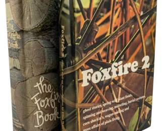 836 - 2 Vintage Foxfire Books (Description): Two vintage Foxfire books documenting  Appalachian heritage, folklore, and  traditional skills. This set includes The  Foxfire Book and Foxfire 2, both edited with  introductions by Eliot Wigginton. These beloved volumes feature interviews and  articleson topics including ghost stories,  spring wild plant foods, spinning and  weaving, midwifing, burial customs, corn  shuckin's, wagon making, and more affairs of