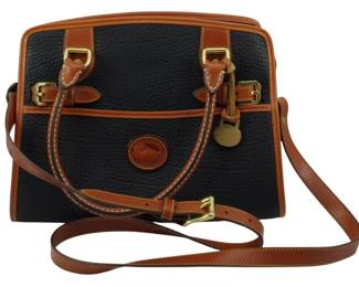 1783 - Dooney & Bourke All Weather Leather Bag (Description): Dooney & Bourke All Weather Leather bag. This  classic handbag features the brand's  signature pebbled leather construction with  contrasting leather trim and brass-tone  hardware. Includes adjustable crossbody strap and the iconic Dooney & Bourke duckmedallion  logo.