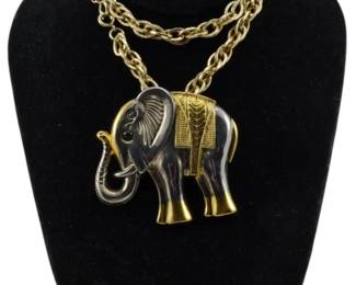 1892 - Two Tone Elephant Pendant Necklace (Description): Two tone elephant pendant necklace featuring  a decorative elephant pendant on a chain. The  elephant displays contrasting two tone  metallic finishes.