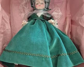 1381 - Madame Alexander Scarlett Doll 14" (Description): Madame Alexander Scarlett doll measuring 14  inches. The doll is presented in its original  box with pink tissue paper. Features the  iconic character from Gone with the Wind  dressed in a green velvet gown with gold trim detailing.