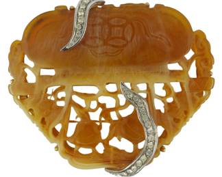 1906 - Kenneth Lane Carved Carnelian/Agate Brooch (Description): Kenneth Lane carved carnelian and agate  brooch. This decorative piece features  intricate carved detailing in the  carnelian/agate material with silver-tone  metalwork accents set with rhinestones.