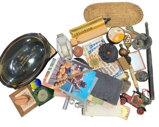 1203 - Assorted Vintage Collectibles & Ephemera Lot (Description): Assorted vintage items in gold and various  colors, measuring 25 inches. This eclectic  collection includes a 1992 commemorative  black oval tray with gold stars, a cast iron  toy car or train, vintage postcards and ephemera, a wooden magnifier, woven basket  tray, glass marble, small jade-colored carved  piece, vintage tins, a wooden baseball  block, metal clamp, and various other  decorative objects and curiosities. A diverse