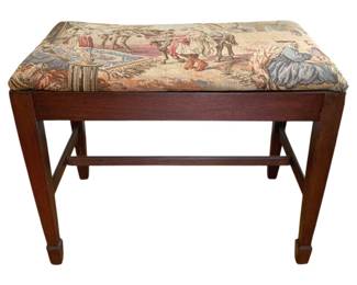 1348 - Tapestry Upholstered Vanity Stool 23.5x15x18" (Description): Vanity stool featuring a tapestry upholstered  seat with a figural scene depicting  classical figures and horses. The stool has a  mahogany-toned wood frame with straight  legs, stretcher base, and spade feet.