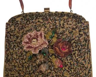 2787 - Soare Bag NY Beaded Floral Handbag (Description): Soare Bag NY vintage beaded handbag featuring  elaborate floral needlepoint design with  pink roses accented by colorful seed beads  and rhinestone centers. The bag has a  tortoiseshell-style lucite top handle, decorative gold-tone metal frame with ornate  filigree corners, and push-lock closure.  Measures 11.5" x 12.5".