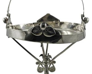 92 - Meriden Britannia Co. Silver Plate Basket (Description): Meriden Britannia Company silver plate bridal  basket featuring an elegant swing handle and  decorative floral motifs. Measures 15" x  11".