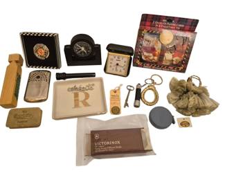 2745 - Group Vintage Collectibles & Desk Accessories (Description): A group of vintage collectibles and desk  accessories including a Coca-Cola Nostalgia  playing cards set in collectible tin (2  decks), travel alarm clocks, a Victorinox  Swiss Army knife in original packaging, including a Jon-E hand warmer style, an Art  Deco style black desk clock, a ceramic  ashtray with gold 'R' monogram, vintage  skeleton keys, a Fossil brand keychain,  keychains and miscellaneous small collectible