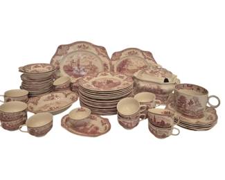 2719 - 70pc Johnson Bros Red Willow Dinnerware (Description): A collection of approximately 70 pieces of  Johnson Brothers red transferware dinnerware  featuring scenic landscape designs. The set  includes dinner plates, salad plates, cups,  saucers, serving platters, and a covered dish. The pieces display traditional English  countryside and architectural scenes in red  transfer print on cream-colored earthenware.  Many pieces exhibit chips and cracks  throughout.