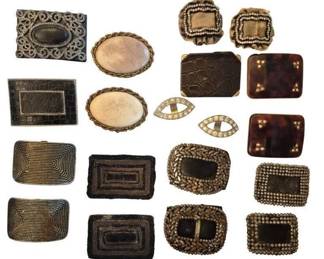 1470 - Group Vintage Shoe Buckles (Description): A collection of vintage shoe buckles  featuring a variety of styles and materials.  The group includes beaded buckles with  concentric rectangular patterns, ornate  filigree designs, faux tortoiseshell examples with brass studs, oval stone-centered  buckles with decorative borders,  rhinestone-accented pieces, and textured faux  crocodile leather styles. The collection  showcases both matched pairs and individual