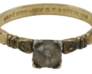 1743 - 12K Gold Filled & Sterling Ring 0.47oz (Description): Size 6,75 A ring crafted from 12K gold filled  and sterling silver. The piece features a  central stone flanked by smaller accent  stones in an elegant setting. Weight: 0.47oz.