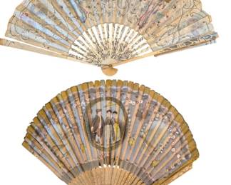 1438 - Two Antique Hand-Painted Folding Fans (Description): A pair of antique hand-painted folding fans  featuring decorative scenes. One fan displays  figural vignettes with ornate scrollwork and  floral motifs on a light ground with carved  and pierced bone sticks. The second fan showcases a central medallion with a courting  couple in period dress, surrounded by floral  sprays on a silvery-blue ground with wooden  sticks. Approximately 10" long.