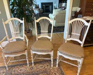 6 chairs- 2 of them have arms- rattan seats