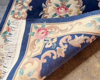 This lot features an antique Chinese floral handmade rug that measures, 60” H x 36” W.