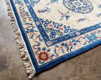 This lot features a hand made 100% wool rug from the People’s Republic of China in a cream color. Measures, 138” H x 99” W.