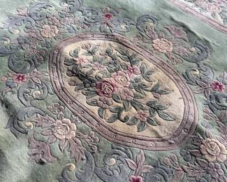 This lot features a Chinese wool area rug that measures, 11′ x 8′. 