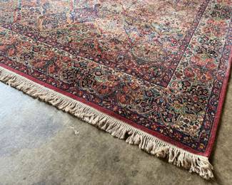 This lot features a Karastan multi-color panel Kirman area rug that measures, 14′ x 10′. 